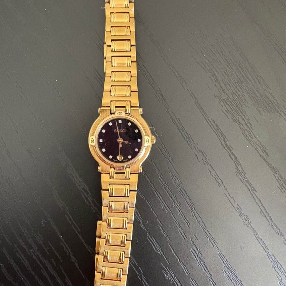 Gucci Gold Bracelet Watch with Black Face